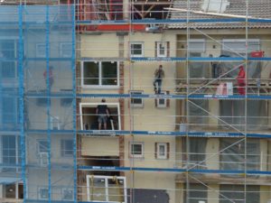 Men working on the building using scaffolding