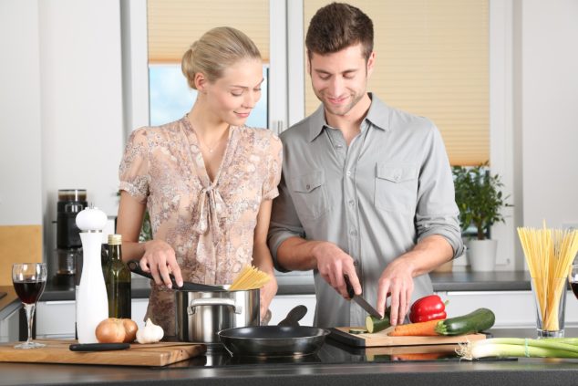 a couple cooking meals